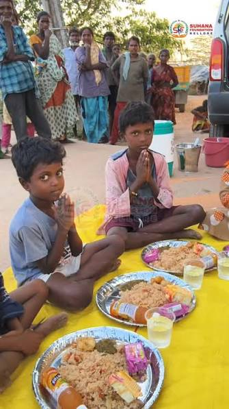 Volunteers serving hot meals during a community food distribution